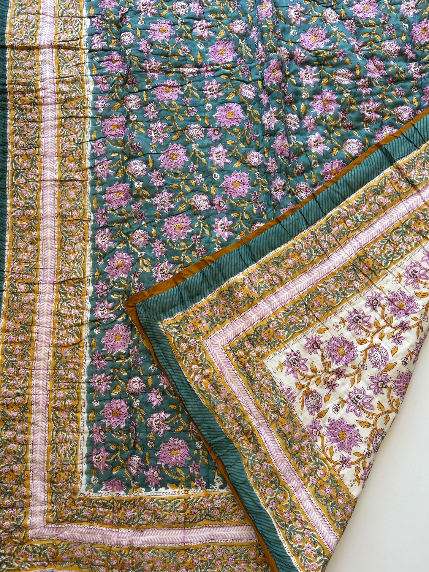 Padded blanket - green-blue/ochre